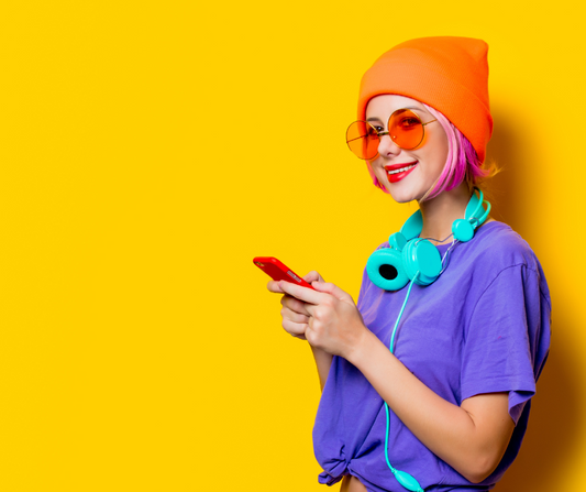 woman wearing headphones and an orange beanie
