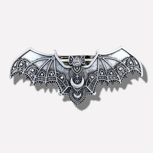 Decorative bat-shaped object with intricate patterns on a white background