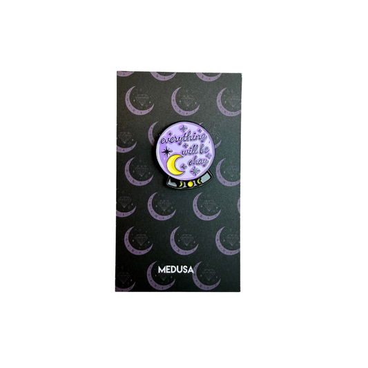 Pin with 'Everything will be okay' message on a black card with crescent moon pattern, brand 'Medusa' visible.