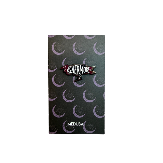 Pin with 'Nevermore' design on a black card with crescent moon pattern, brand 'Medusa' visible.
