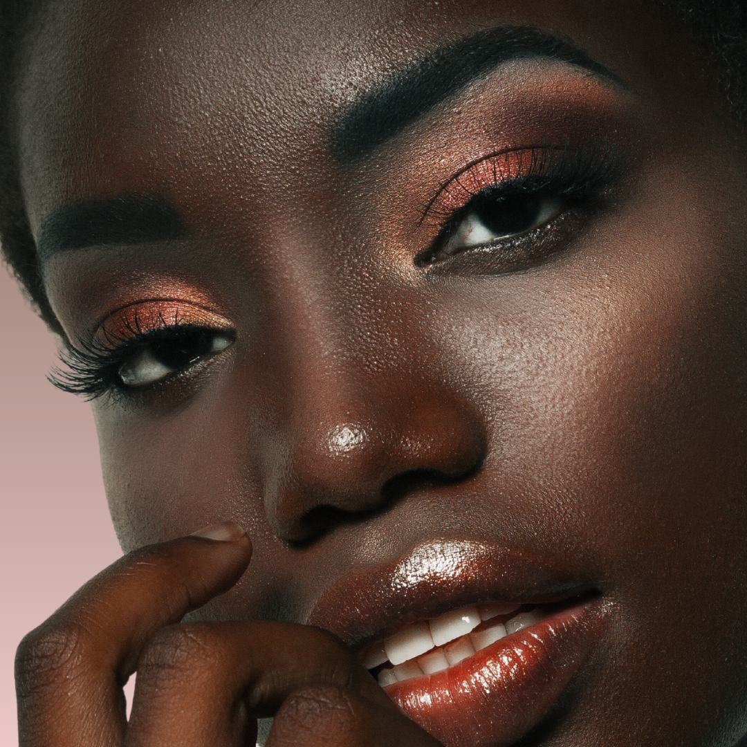 African female model wearing shimmer eye dust eyeshadow makeup