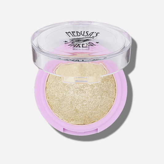 Makeup compact with gold powder and pink casing on a white background - Baked Eyeshadow - After Hours