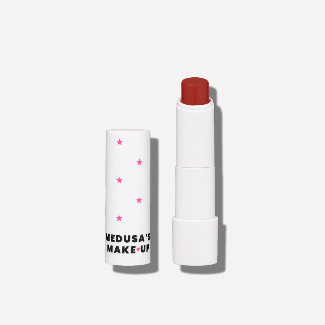 Lipstick with packaging labeled 'Medusa's Make-Up' on a white background