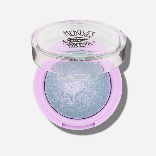 Makeup product with purple case and blue shade on a white background - Baked Eyeshadow - Wild One