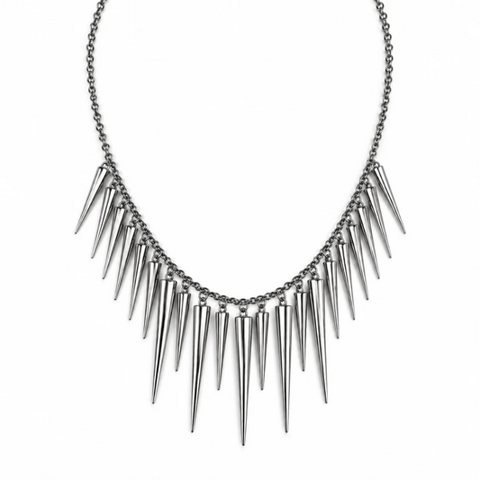 A silver-toned spiked collar necklace with a delicate chain and multiple sharp conical spikes, shown against a plain white background.