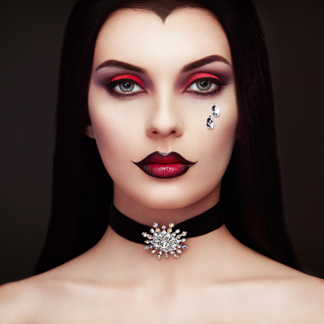 Vampire wearing period makeup and costume