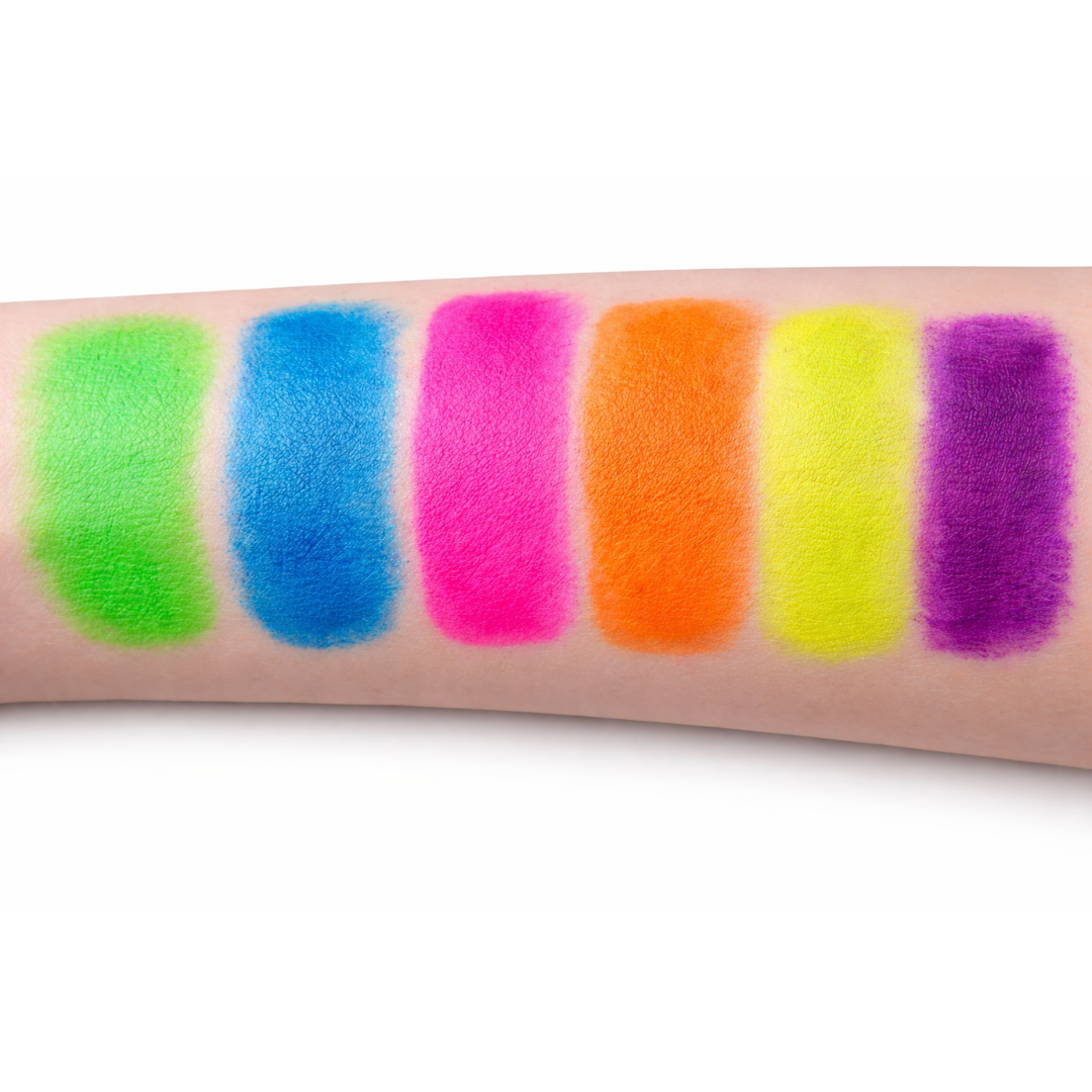 Neon lip swatches on a person's arm with a white background