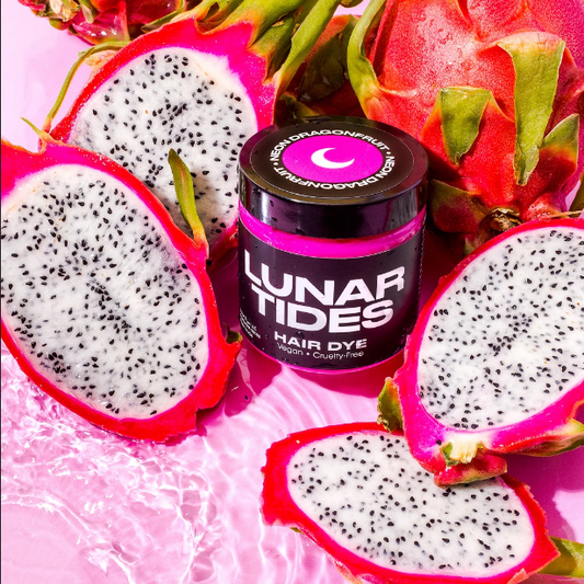 Lunar Tides Hair Dye - Neon Dragonfruit, in a scenery of opened dragonfruit.