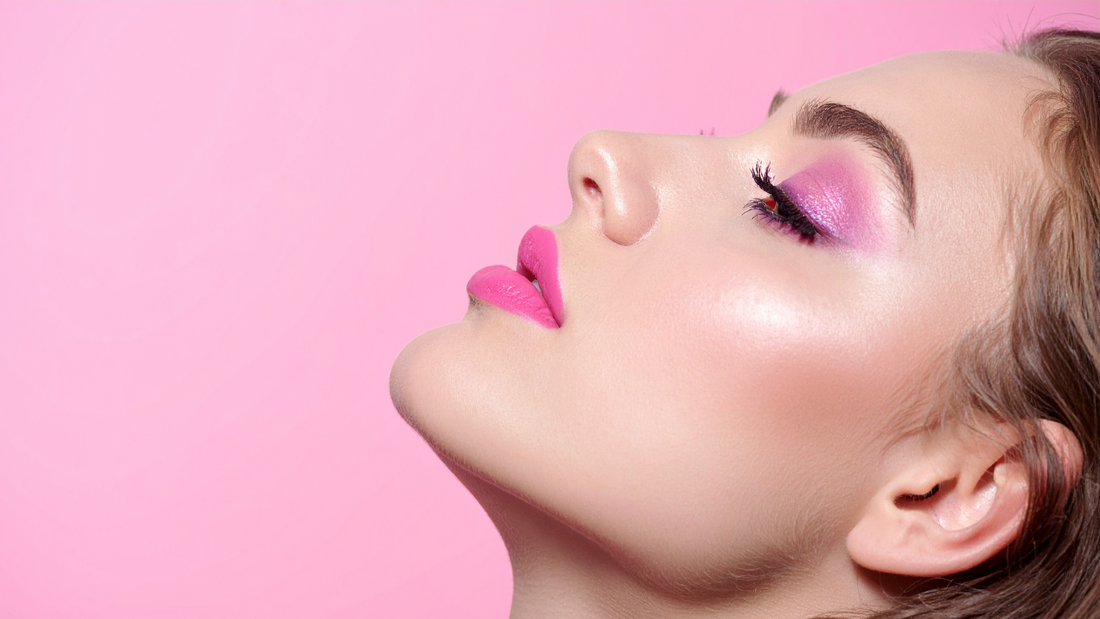 woman wearing pink eyeshadow and pink lipstick