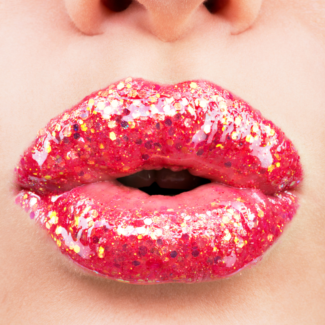 Medusa's Makeup Sparkly red lip gloss with glitter mixed in on a models lips.