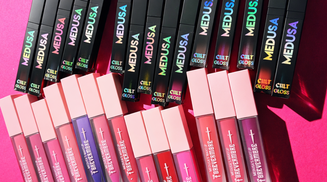 lipsticks and lip glosses on a pink background