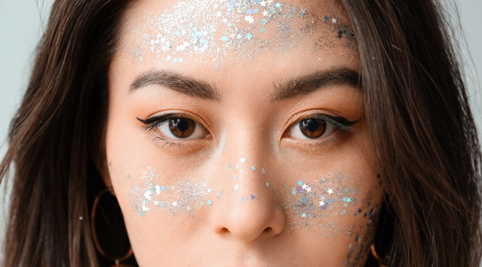 woman with glitter across her cheeks and forehead