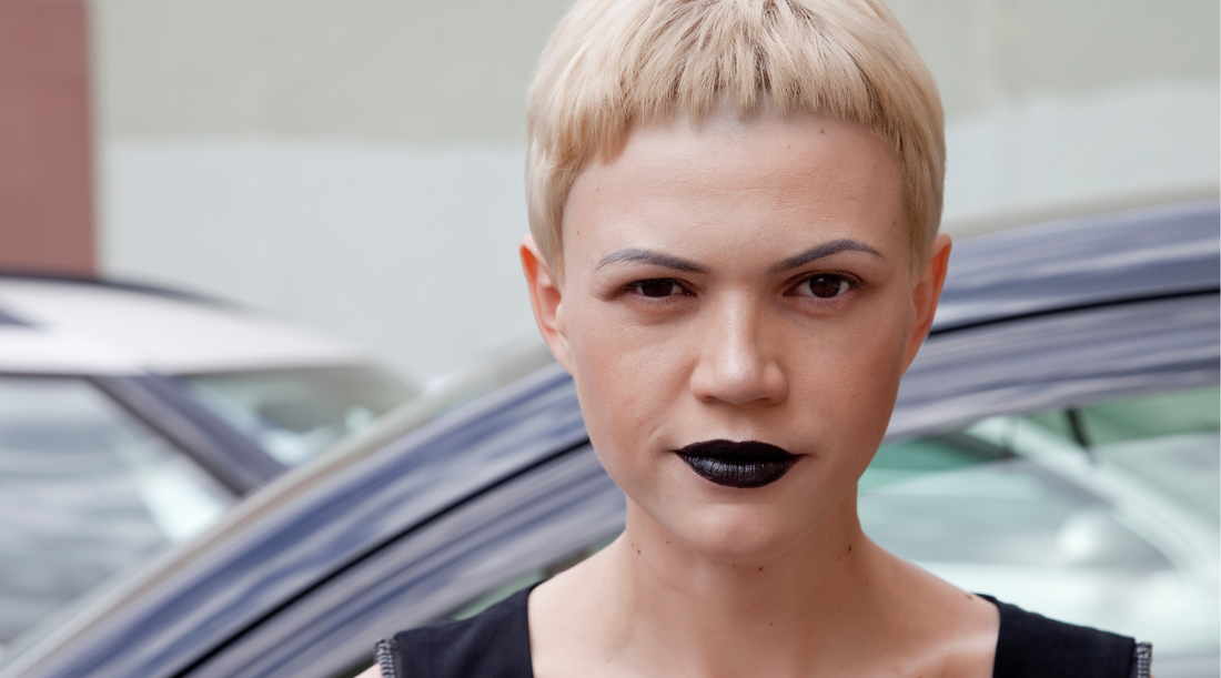 woman with short blonde hair and black lipstick
