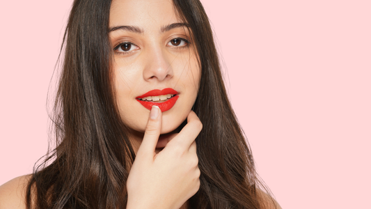 woman with dark hair wearing smudge proof red lipstick