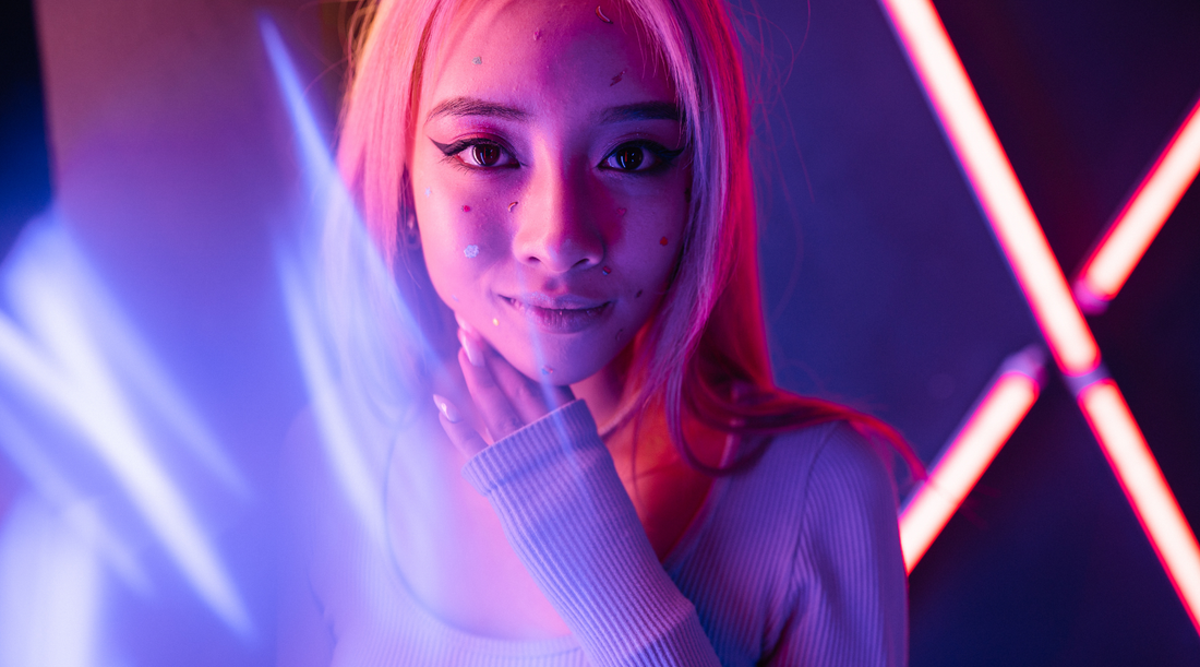 girl with neon pink hair under a night club blacklight