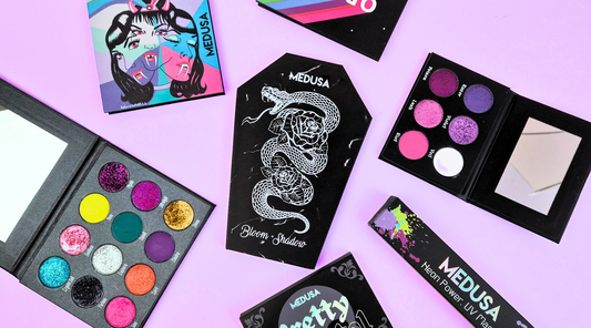 medusa's makeup palettes on a purple background
