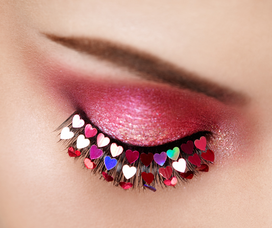 pink eyeshadow with heart decals on the lashes