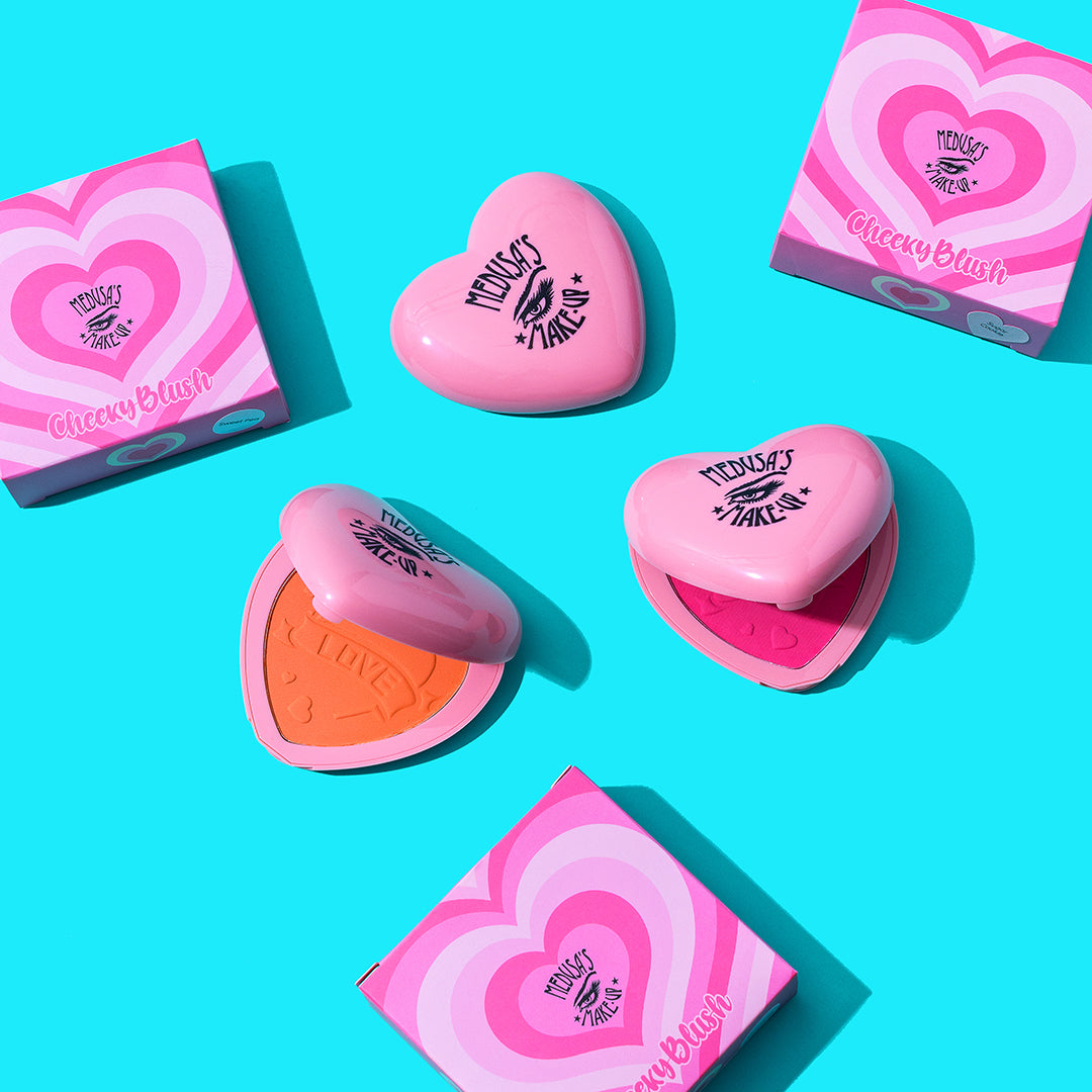 cheeky blush, heart shaped compact on a blue background
