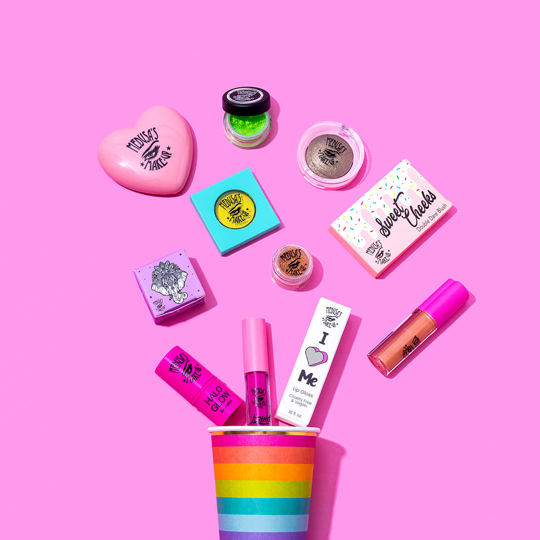 Medusa's Makeup spread around a pink background with a rainbow cup