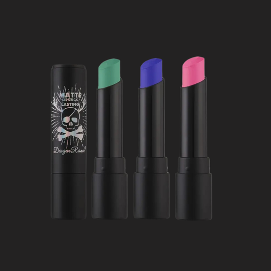 Four lipsticks with different colors on a black background