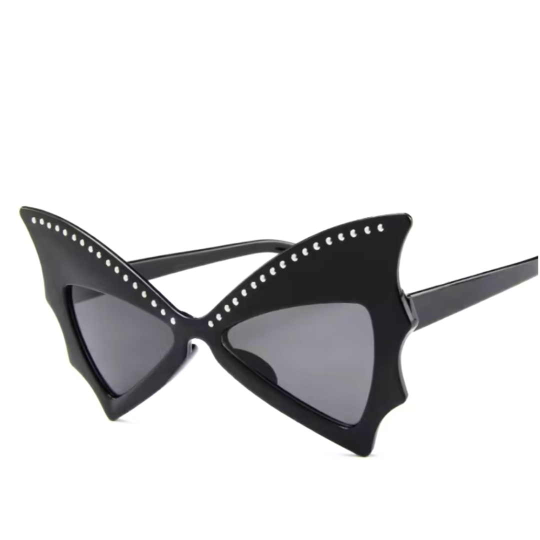 Black cat-eye sunglasses with rhinestone details on a white background