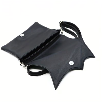 Black leather bat-wing bag on a white background