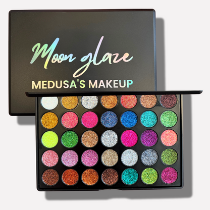 Moon Glaze Medusa's Makeup palette with colorful glittery shades on a white background