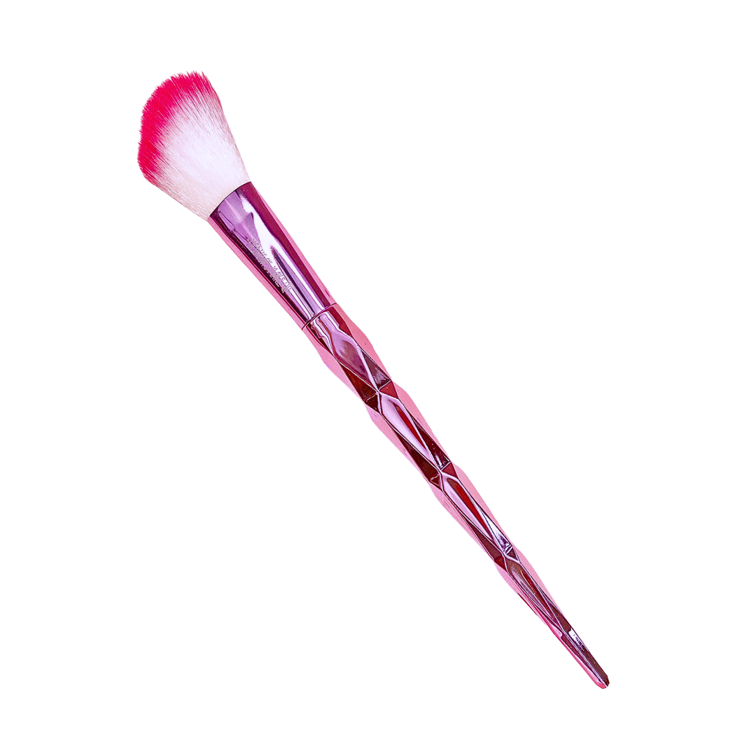 Pink makeup brush with a white bristle head on a white background
