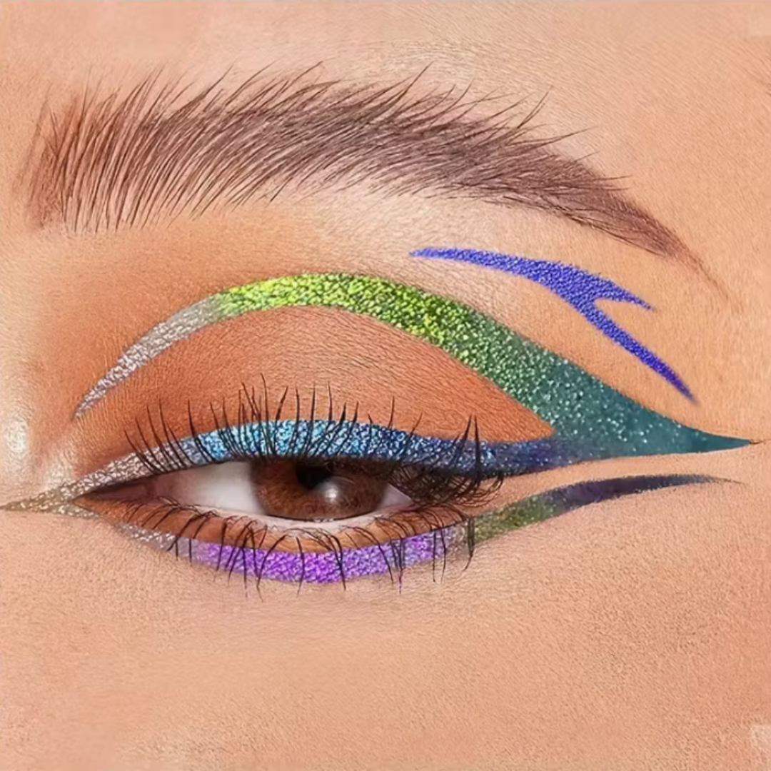 Close-up of an eye with colorful makeup including green, blue, and purple. Duochrome eyeliner graphic liner pen