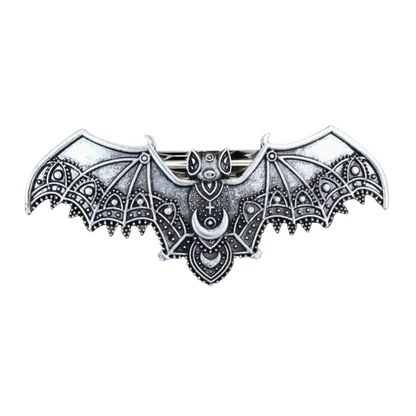 Decorative bat-shaped object with intricate patterns on a white background