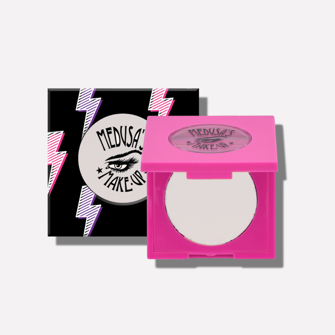 Compact powder in a pink case with 'Medusa's Makeup' branding on a white background