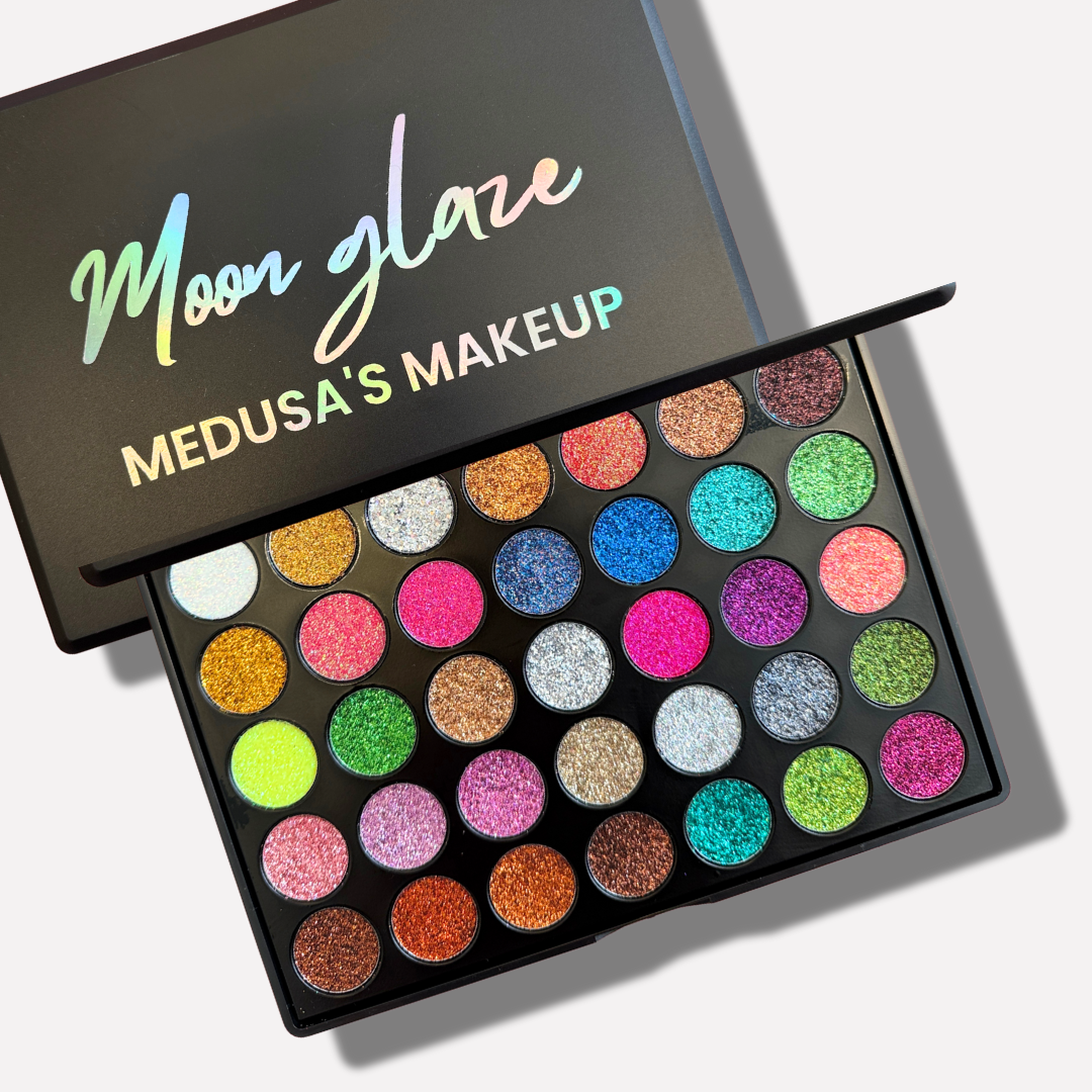 Makeup palette with colorful glitter shades and 'Moon Glaze' branding on a white background