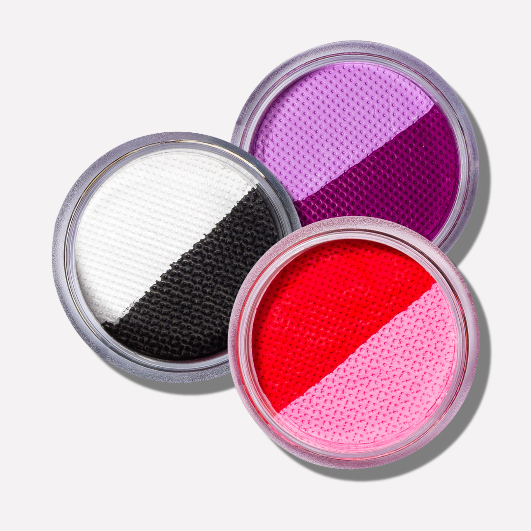 Three open makeup containers with different colored powders on a white background