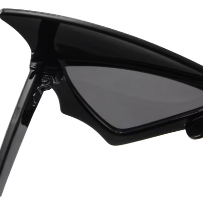 Black sunglasses with a clear lens on a white background