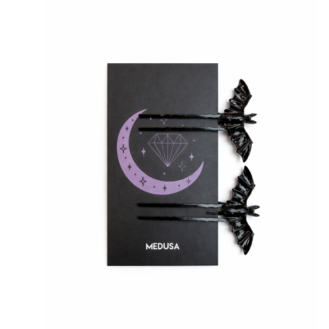 Black hair ties with decorative design on a black card featuring 'MEDUSA' branding.