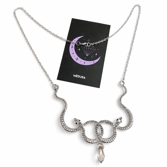 Silver snake necklace with a pendant on a white background