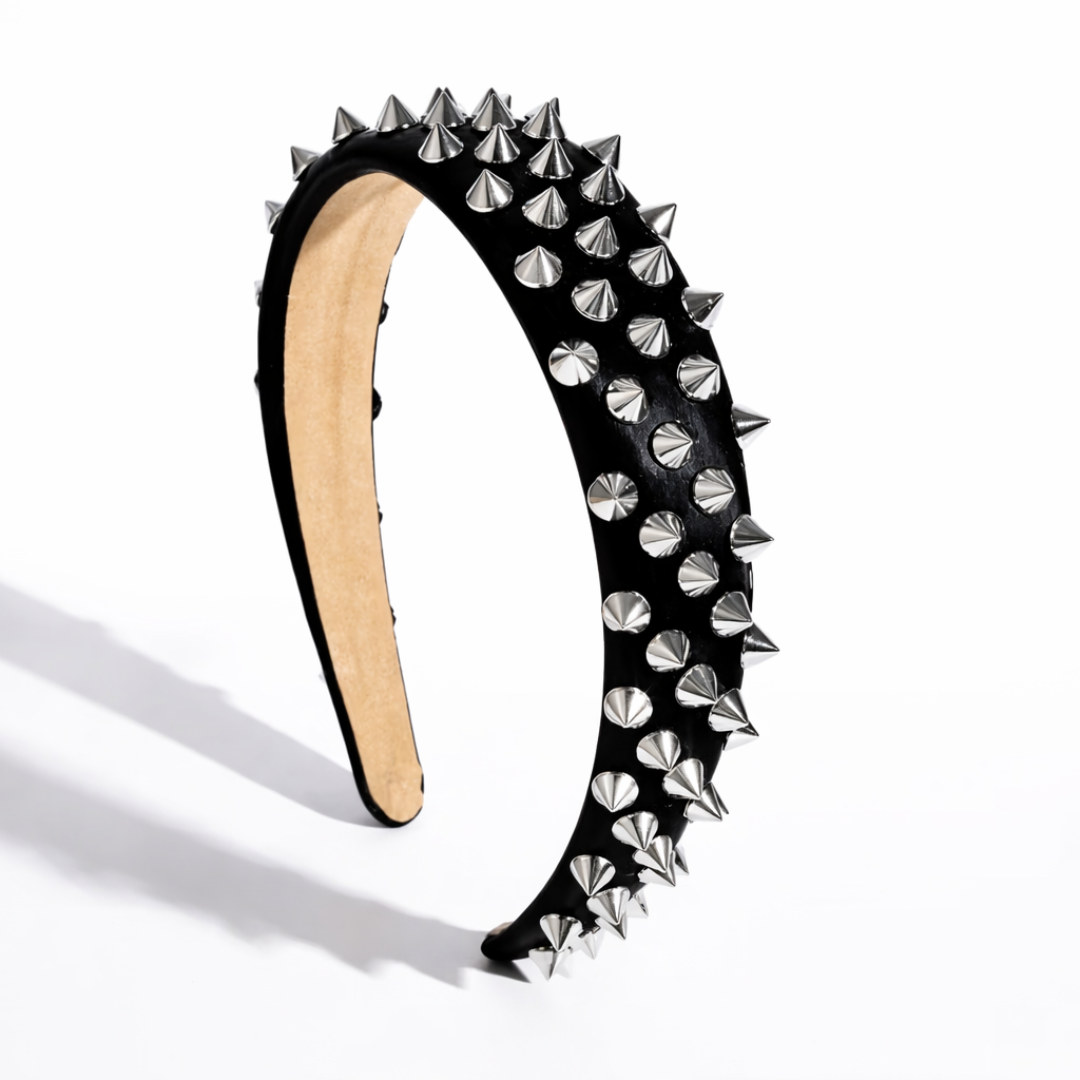 Black headband with silver spikes on a white background