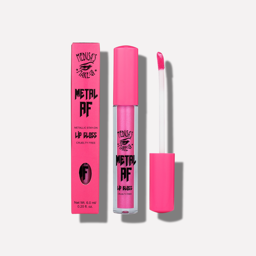 Pink lip gloss with packaging on a white background