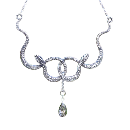 Silver snake-shaped necklace with a teardrop pendant on a white background