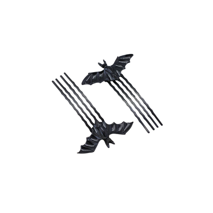 Black bat-shaped hair accessories on a white background