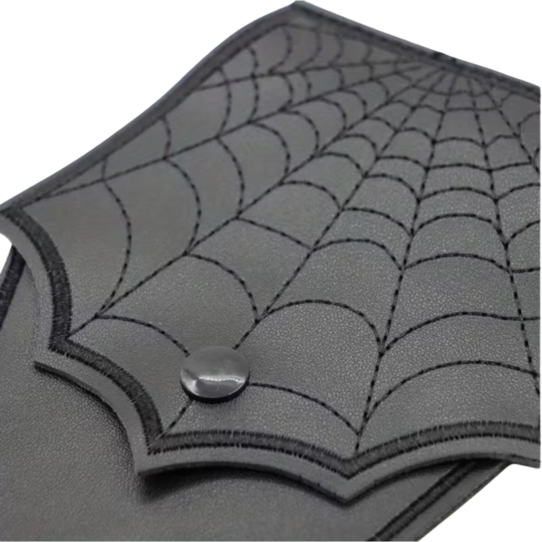 Gray leather wallet with spider web design on a white background
