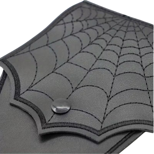 Gray leather wallet with spider web design on a white background