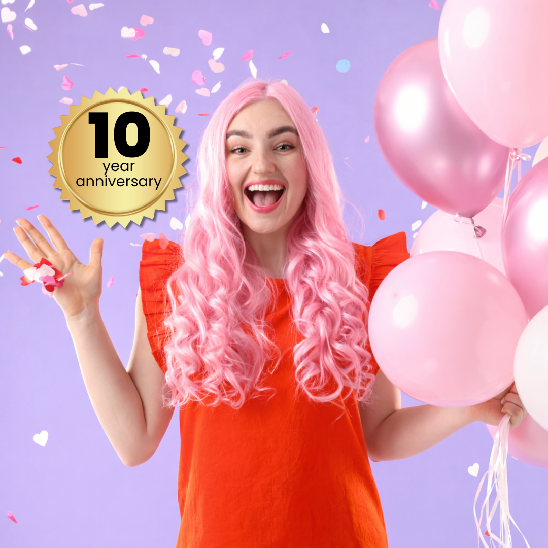 Woman with pink hair and balloons celebrating a 10-year anniversary on a purple background