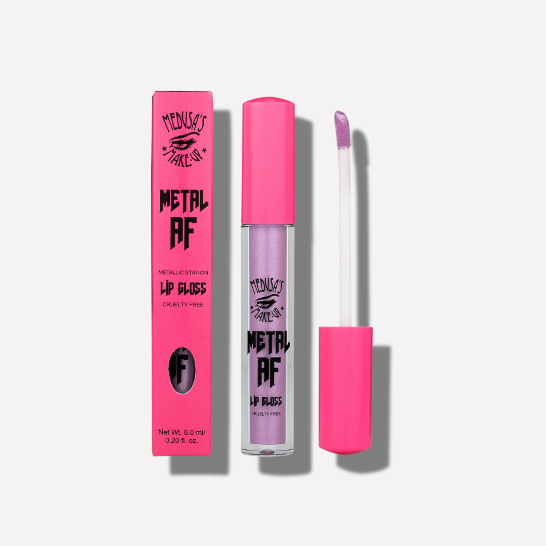 Metallic lip gloss with pink packaging on a white background