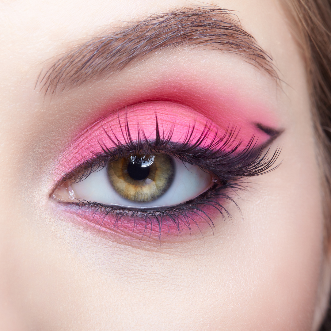 close up eye wearing pink shimmer eye dust eyeshadow with black eyeliner