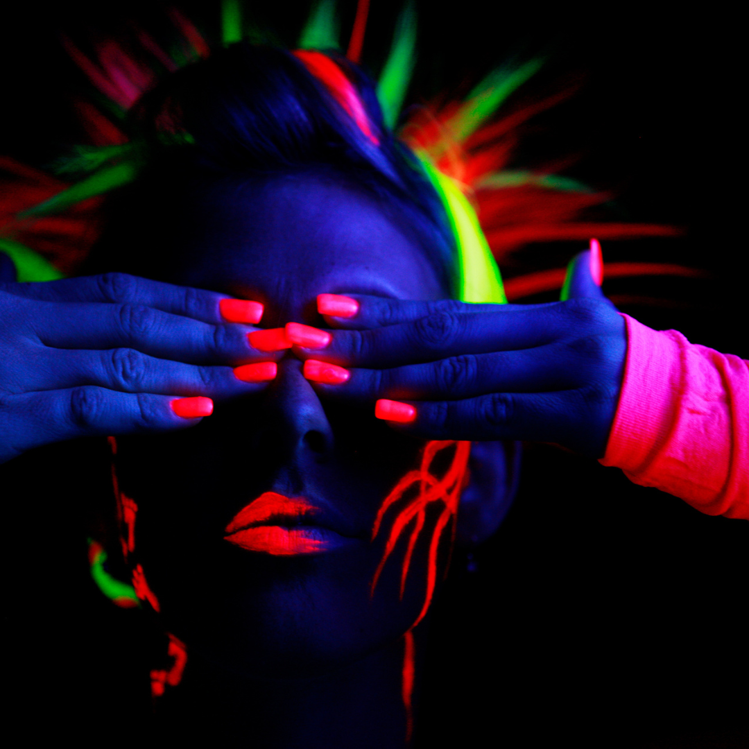 Model wearing neon clothes, neon hair and neon makeup