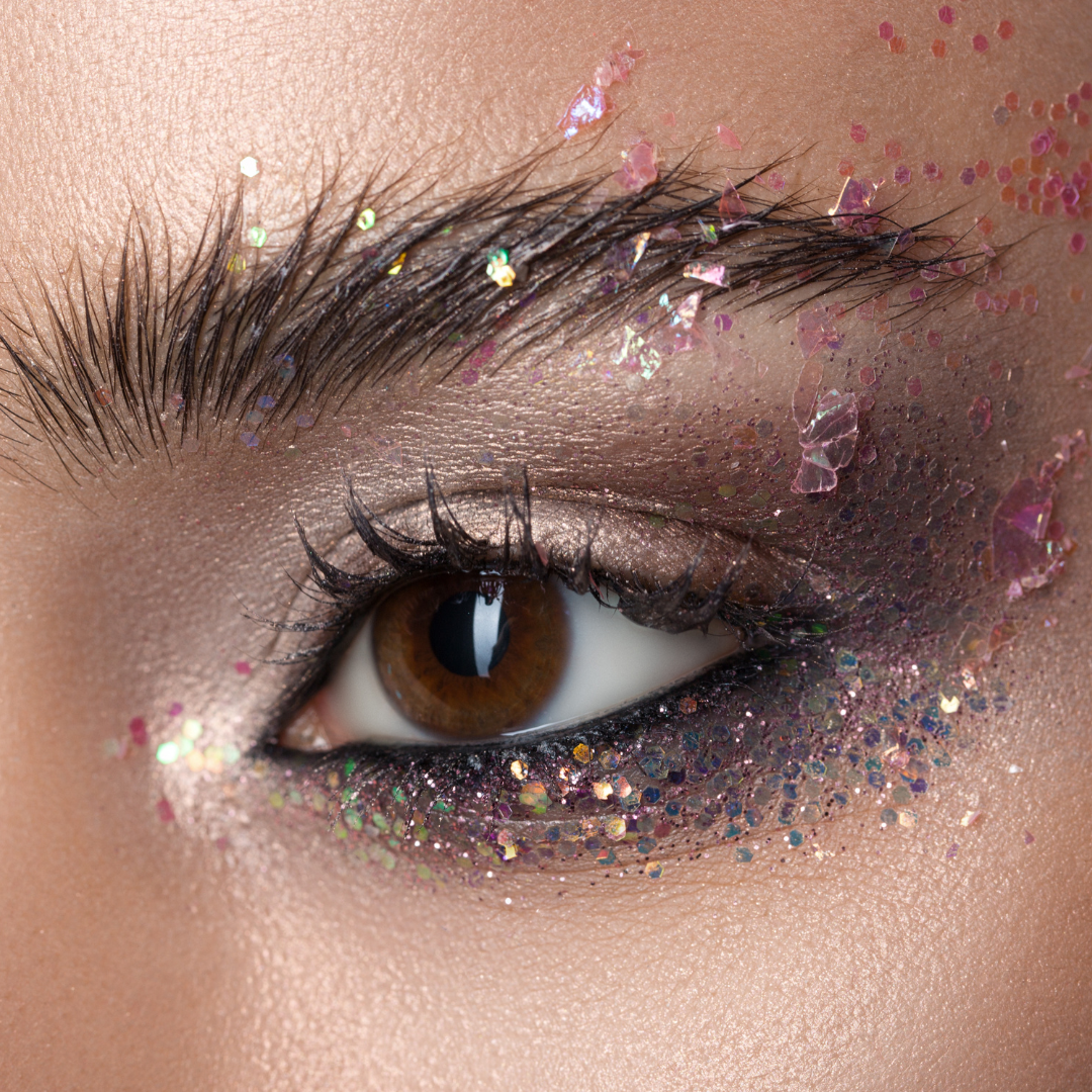 Closeup model eye wearing chunky glitter eyeshadow