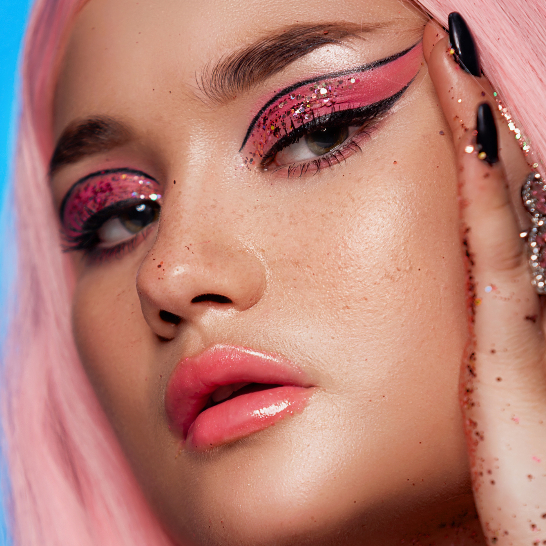 Model wearing witchy liner as graphic liner with glitter eyeshadow