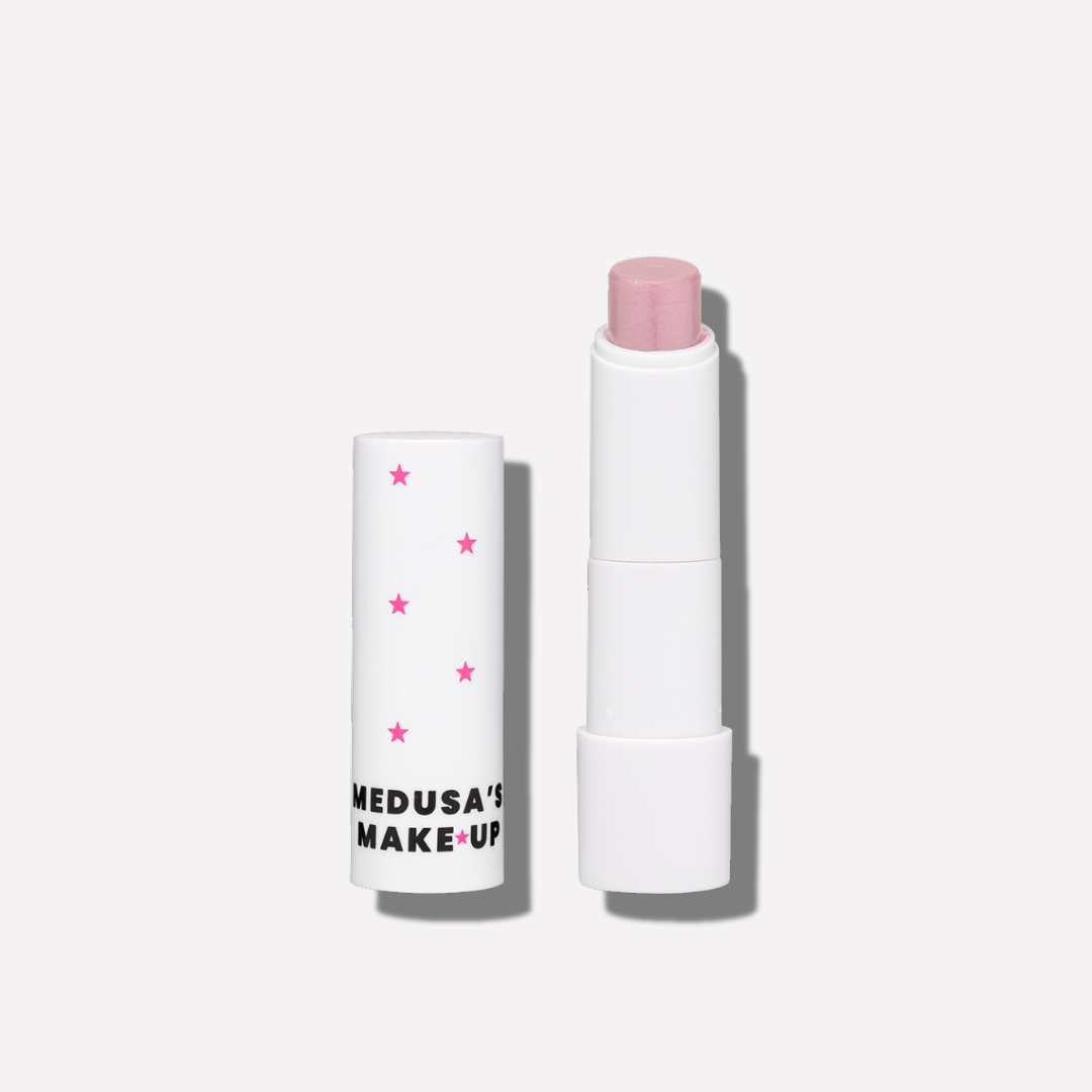 White lip balm with pink cap and visible brand name on a white background