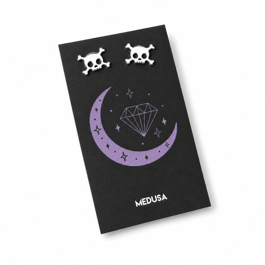 Black card with skull designs and 'MEDUSA' branding on a white background